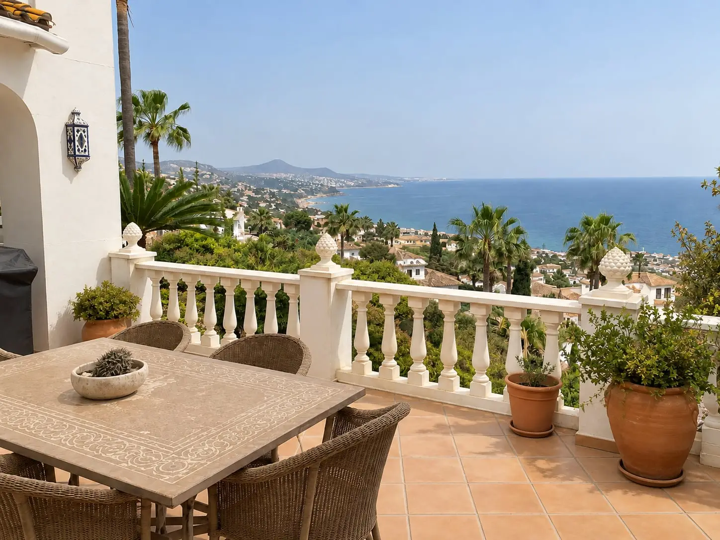The same terrace after cleaning, with the floor, table and balustrade free of dust